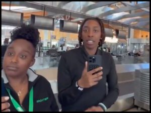 Screenshot from viral video of Frontier Airlines employees fired after refusing to check in a customer at RDU.