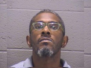 Mugshot and crime scene related to case where Durham man kills mother during altercation on Red Mill Road.