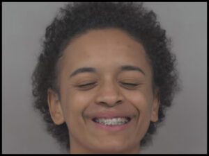 Aviana Ortiz smiling in mugshot after high-speed police chase