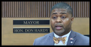 Kinston Mayor Don Hardy faces criticism over increased travel expenses and the city's rising budget.