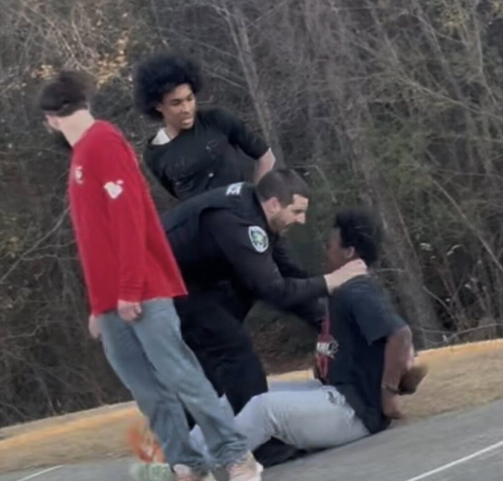 Lillington police officer Andrew Kesick restraining a teen during incident caught on video