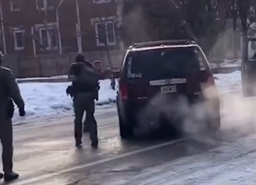 ICE agent pointing gun during Minneapolis ICE operation