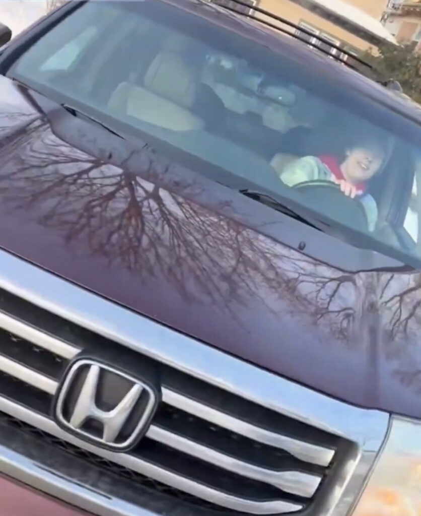 Renée Nicole Good seated in her car moments before being shot by an ICE agent.