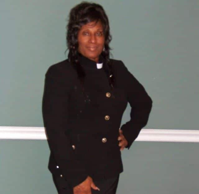 Hands on her hip Pastor Diane Lewis