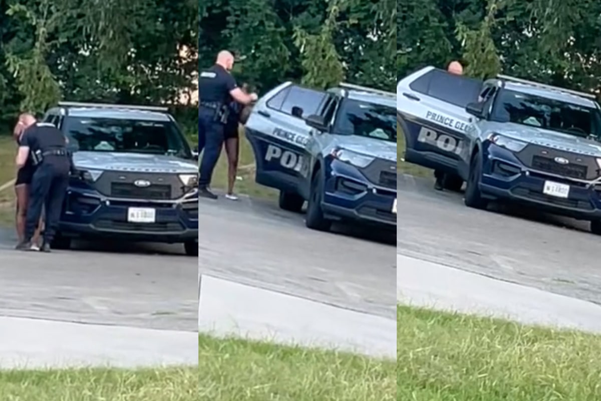 Prince George Police Officer And Woman In Backseat Of Cop Car.