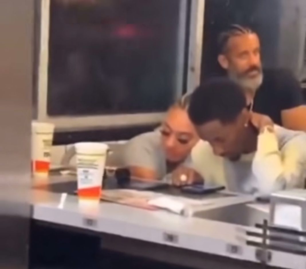 Lemuel Plummer and his cast-member Scotty With The Body inside a Waffle House in Houston in 2022.