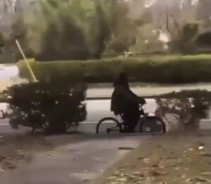 Suspect riding a bike.