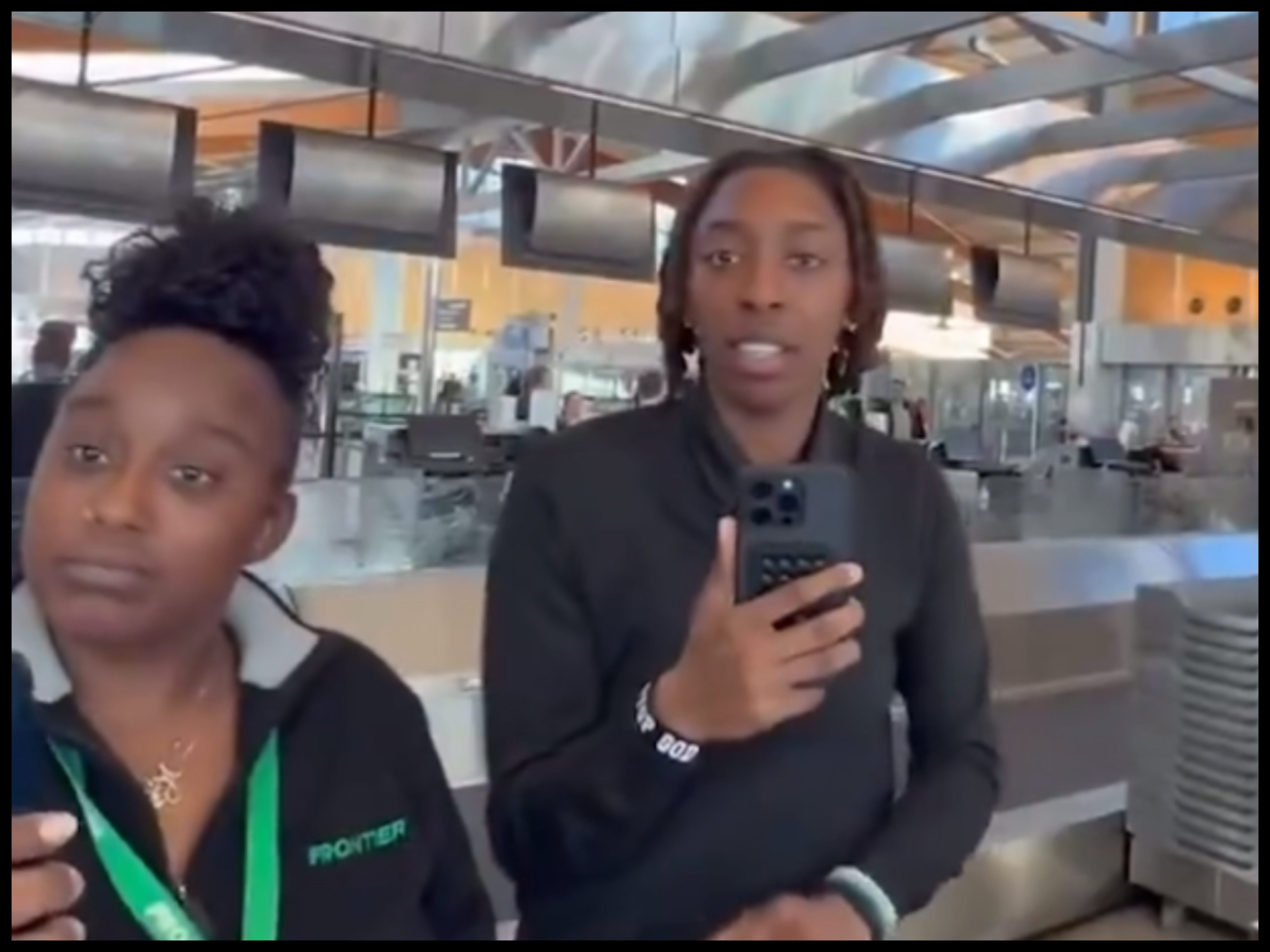 Screenshot from viral video of Frontier Airlines employees fired after refusing to check in a customer at RDU.