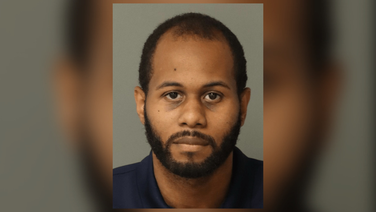 Official mugshot of former Raleigh police officer Tremale Cogdell under FBI civil rights investigation