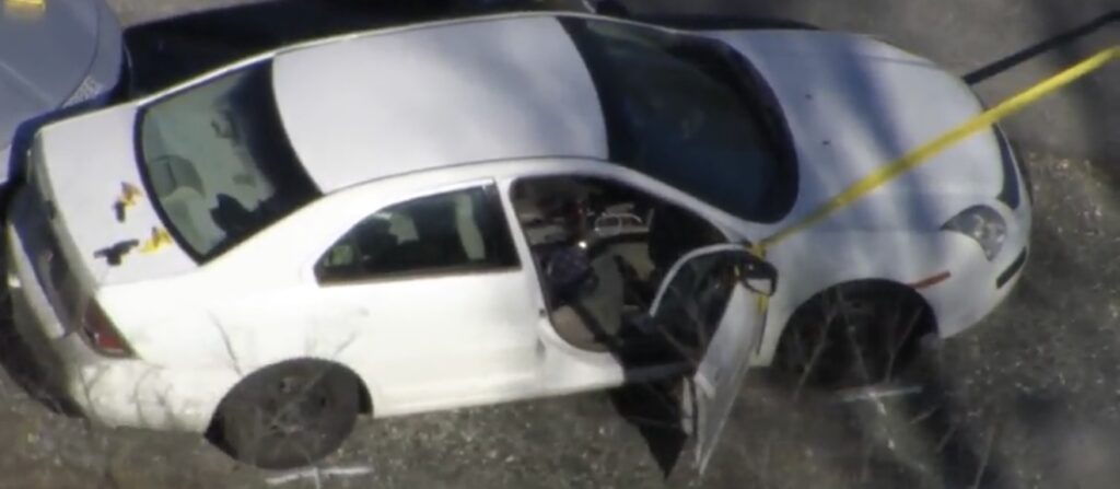 Sky 5 aerial view of white car during greensboro shooting investigation on US 421 South (Photo credit: WRAL News)