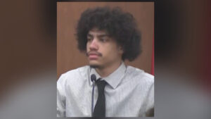 Official mugshot of Issiah Ross wearing an orange jail jumpsuit after his arrest