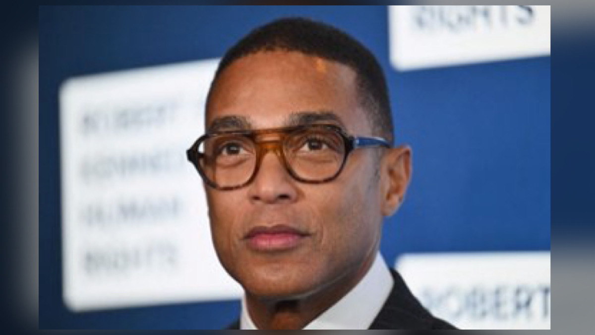 Official portrait of journalist Don Lemon wearing a blue pinstripe suit and tie