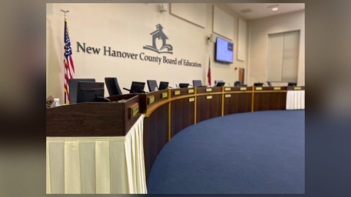 Group photo of New Hanover County school board members sitting in a meeting