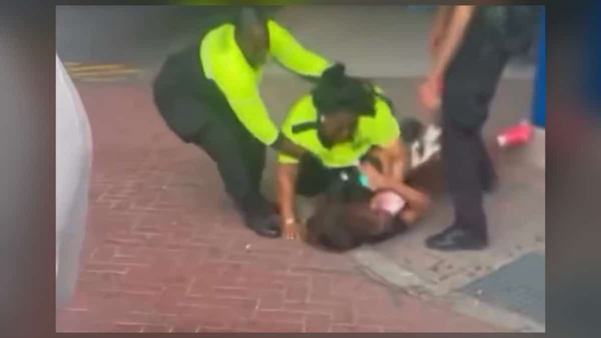 CATS security guard yellow jacket punching kicking teen girl Charlotte Transportation Center video