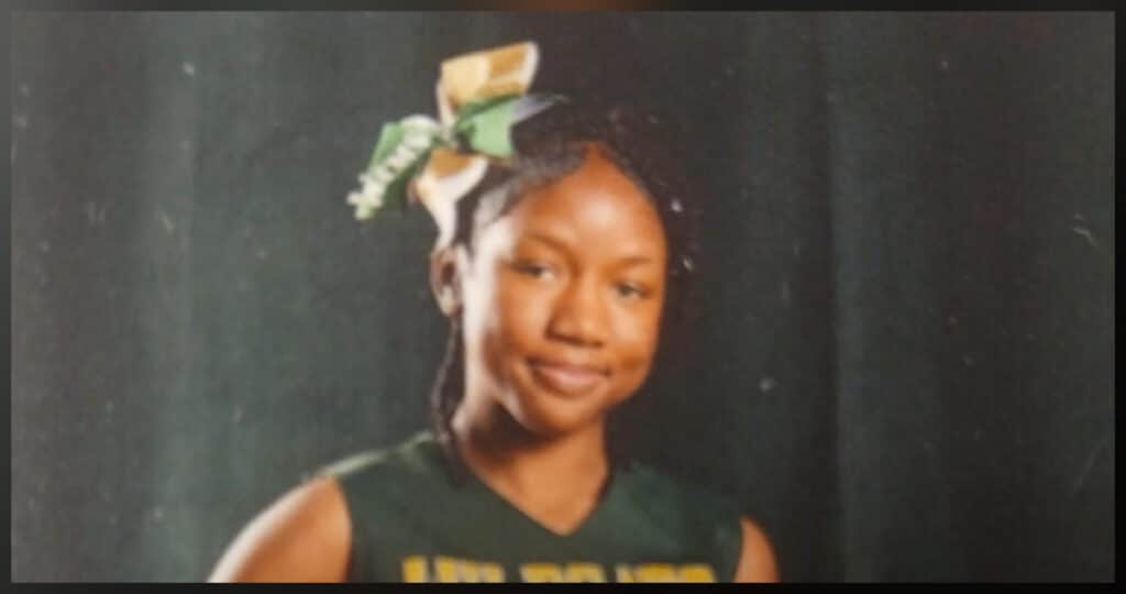 Kendra Hall, 14-year-old missing runaway from New Bern NC, shown in green and gold Wildcats cheerleader uniform