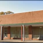 Exterior view of the commercial building at 3409 Brookshire Boulevard Charlotte formerly used by Kingdom City Church