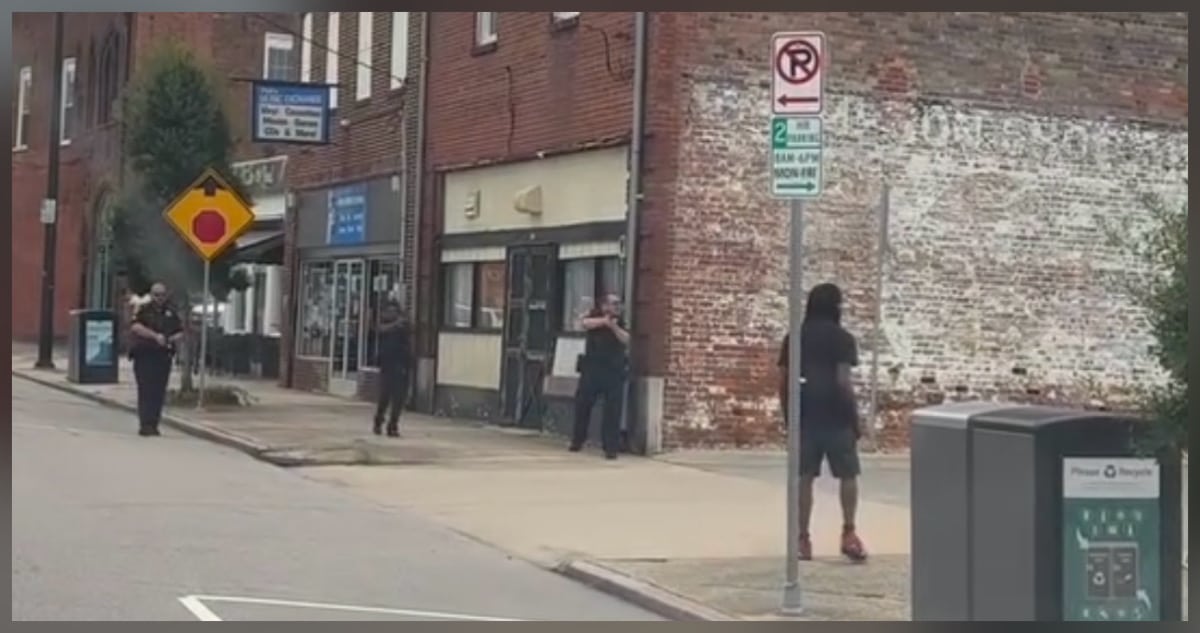 Wilson police officers with guns drawn responding to shooting at Wilson County Courthouse